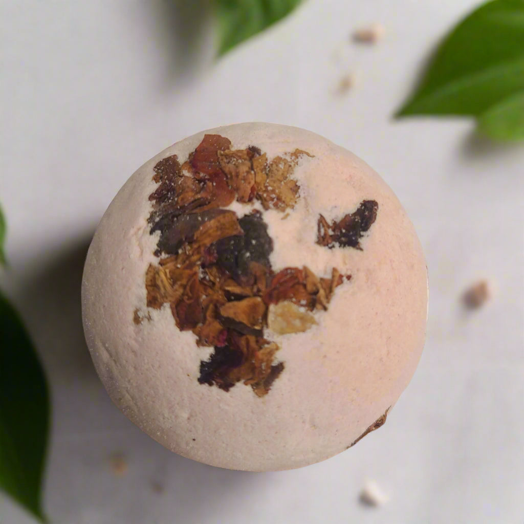 Handmade bath bomb with peppermint essential oil and dry rose petals