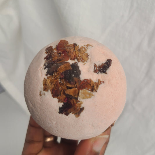 Handmade bath bomb with peppermint essential oil and dry rose petals